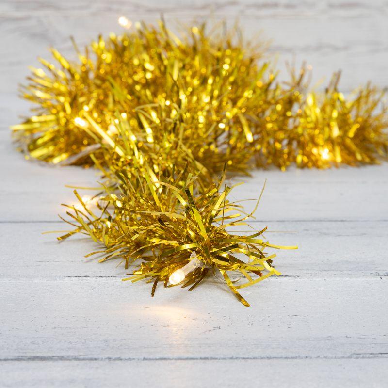 Гирлянда светодиодная "Мишура" 1.5м 10LED зол. тепл. бел. 0.1Вт IP20 провод ПВХ прозр. элементы питания 2хAA (не в ко...